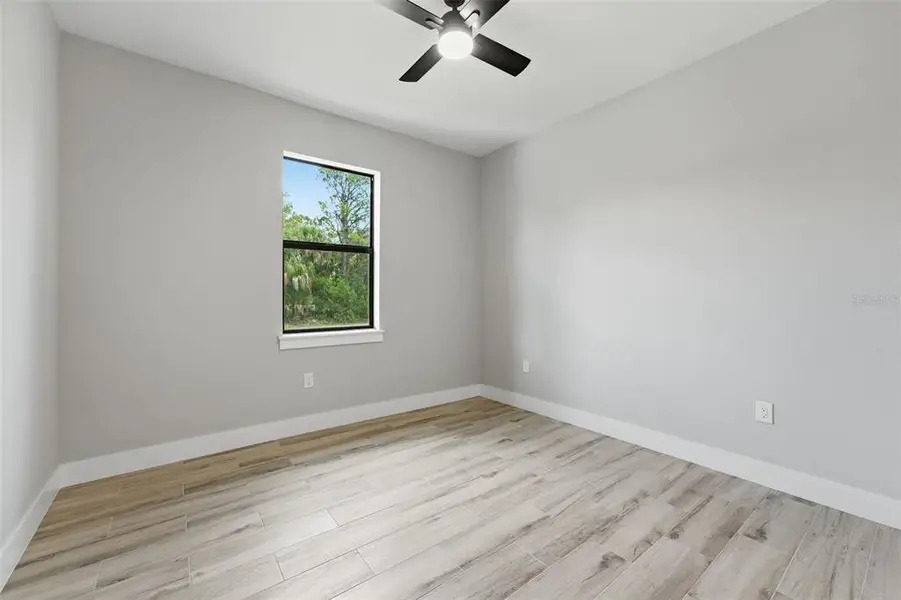 Spacious, unfurnished interior of a new home in , Port Charlotte (Image 18).