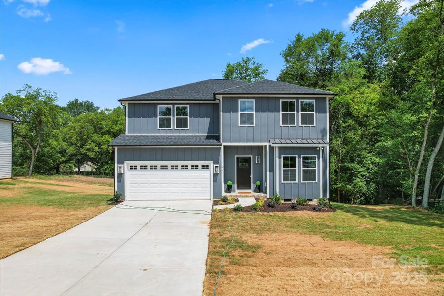 Front exterior of a new home in , Harrisburg, NC, highlighting curb appeal (Image 25).