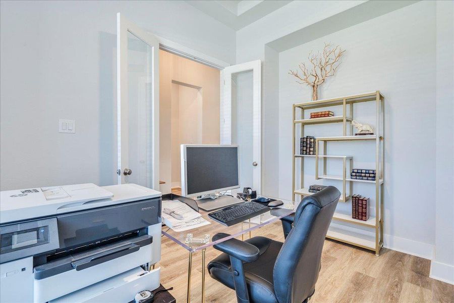 Home office with light wood finished floors and baseboards Home office with light wood finished floors and baseboards