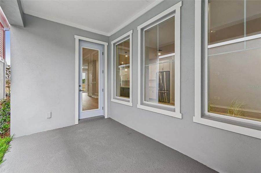 Exterior details and patio area of a home in Laureate Park at Lake Nona - Garden Series, Orlando (Image 4).
