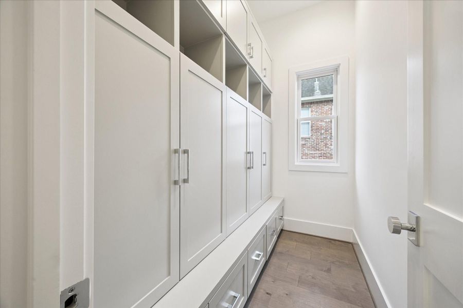 First floor mudroom with lockers, drawers and cubby space. Door closes to hide the mess from guests! First floor mudroom with lockers, drawers and cubby space. Door closes to hide the mess from guests!