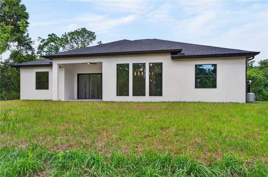 Exterior details and patio area of a home in , North Port (Image 38).
