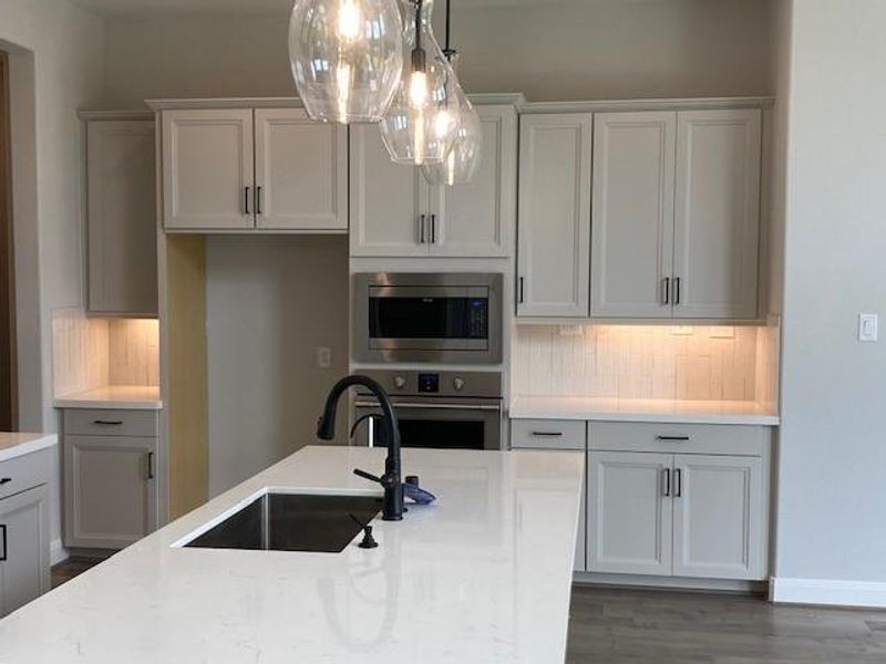 Representative photo of island kitchen. Representative photo of island kitchen.