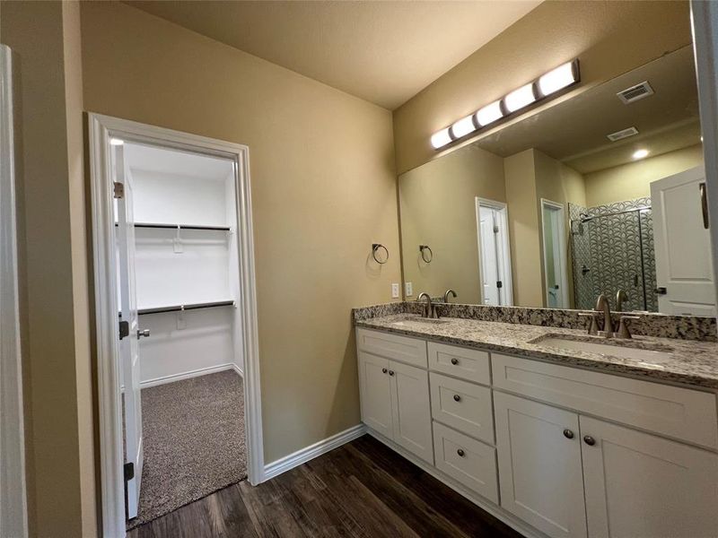 Ensuite Bath with Double Vanity, Tile Surround Shower, Large Walk-in Closet and Private Toilet Closet