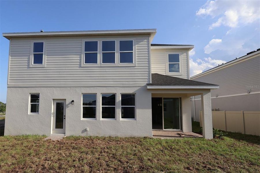 Exterior details and patio area of a home in Bay Lake Farms, St. Cloud (Image 3).