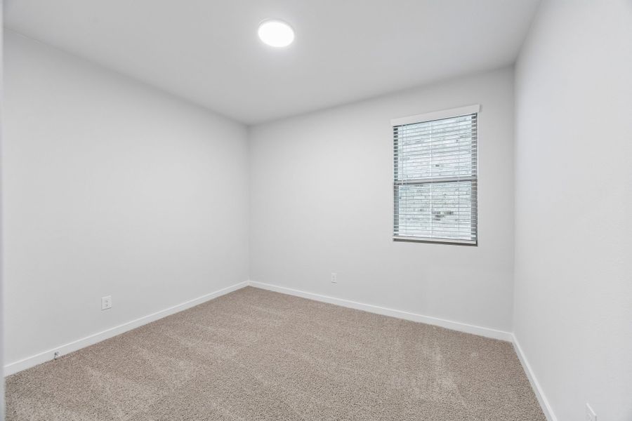 Bedroom in the Cedar home plan by Trophy Signature Homes – REPRESENTATIVE PHOTO