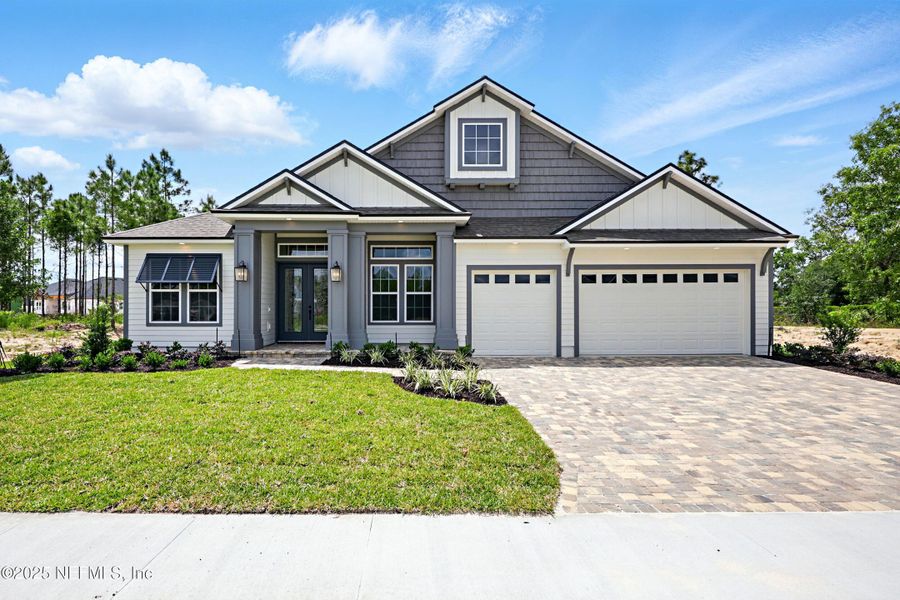 Front exterior of a new home in Courtney Oaks in SilverLeaf, St. Augustine, FL, highlighting curb appeal (Image 24). Front exterior of a new home in Courtney Oaks in SilverLeaf, St. Augustine, FL, highlighting curb appeal (Image 24).