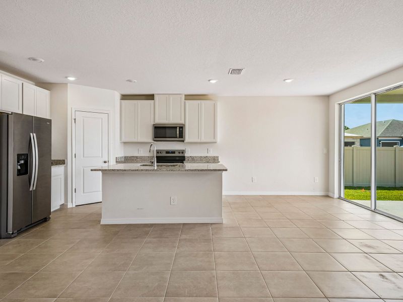 Furnished interior view inside a new home in The Reserve at Van Oaks, Auburndale (Image 5).