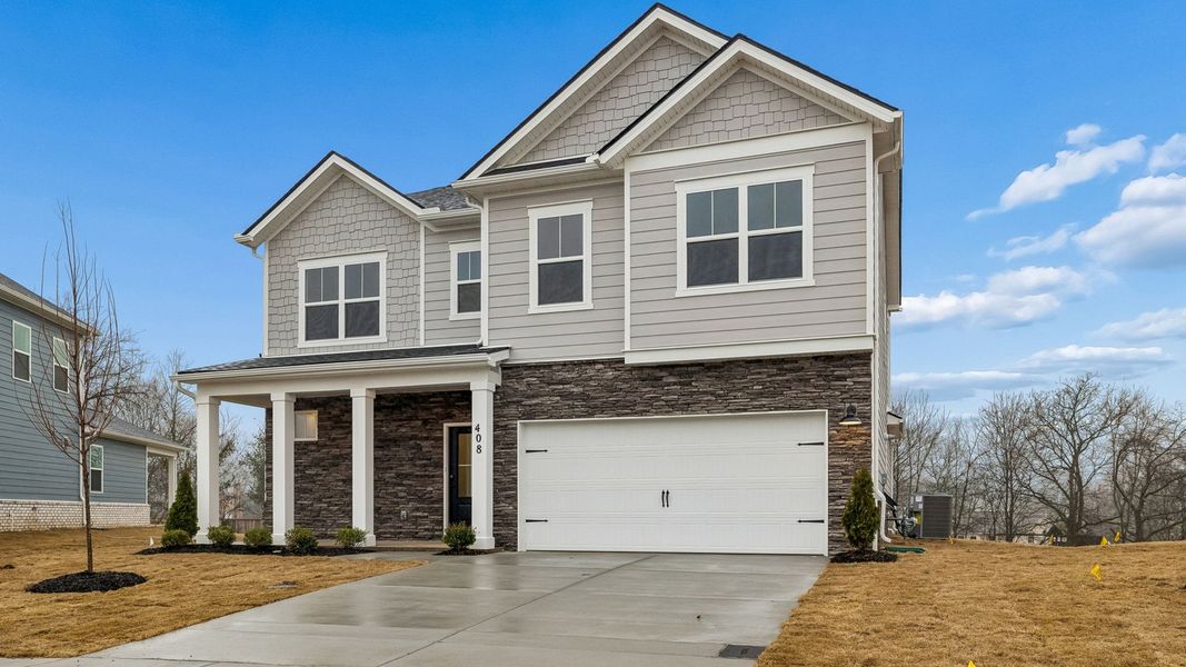 Front exterior of a new home in Harvest Point, Spring Hill, TN, highlighting curb appeal (Image 24).
