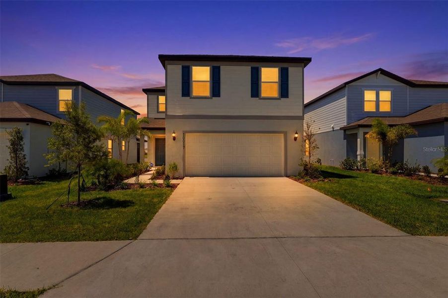 Front exterior of a new home in Oakfield Lakes, Parrish, FL, highlighting curb appeal (Image 27).