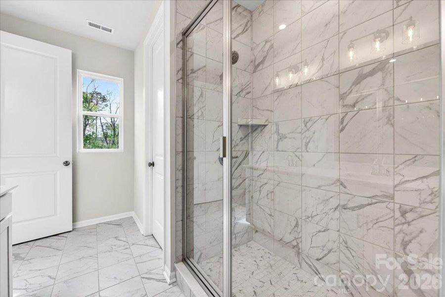 Primary walk-in fully tiled shower Primary walk-in fully tiled shower