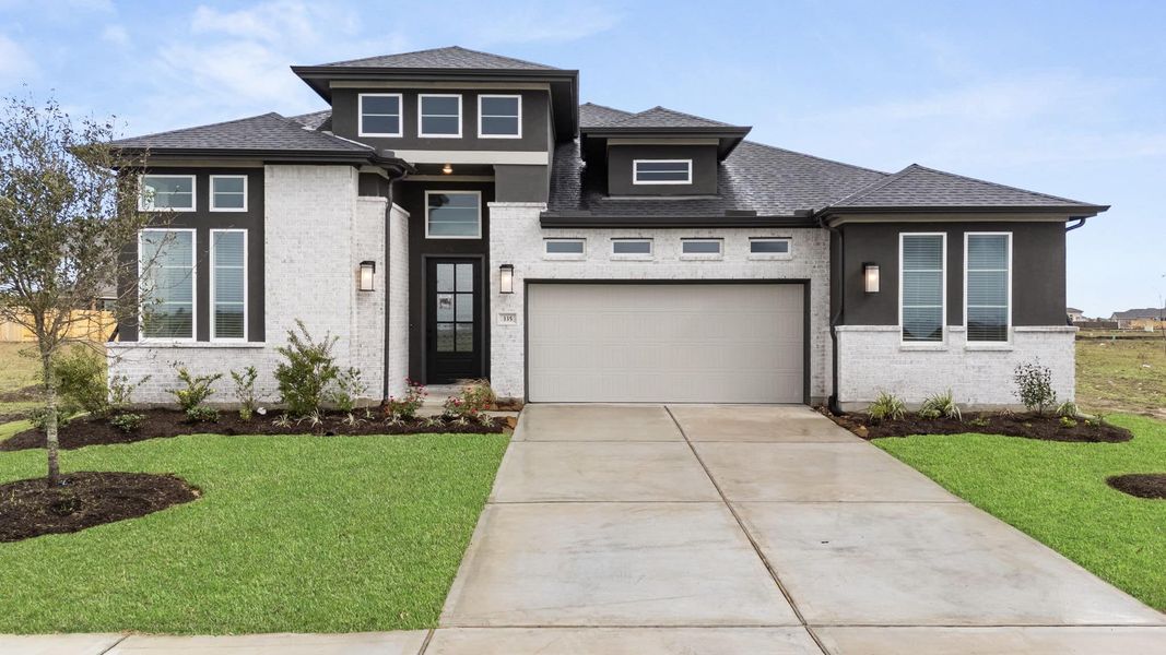 Front exterior of a new home in Fulshear Lakes, Fulshear, TX, highlighting curb appeal (Image 25).