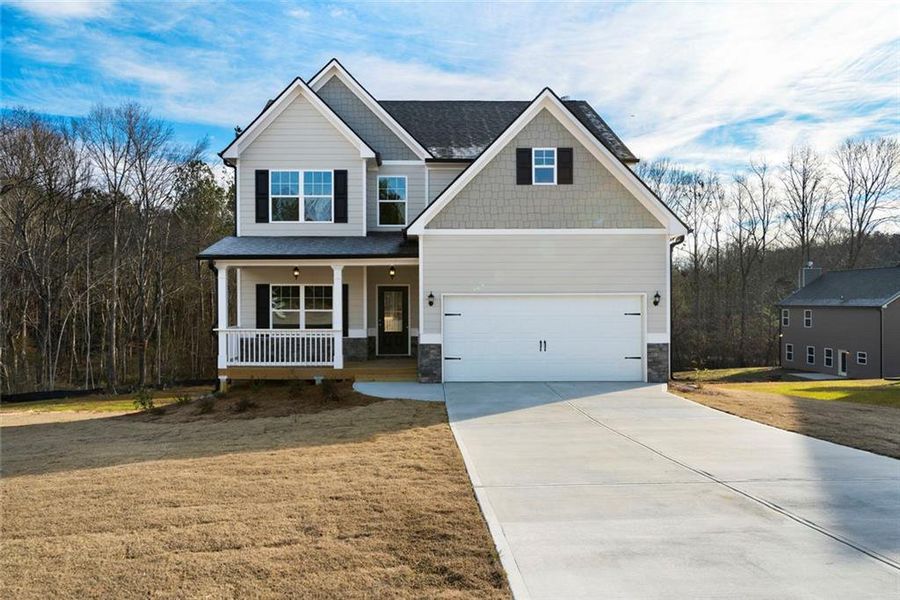 Front exterior of a new home in Benson Estates, Dallas, GA, highlighting curb appeal (Image 1). Front exterior of a new home in Benson Estates, Dallas, GA, highlighting curb appeal (Image 1).
