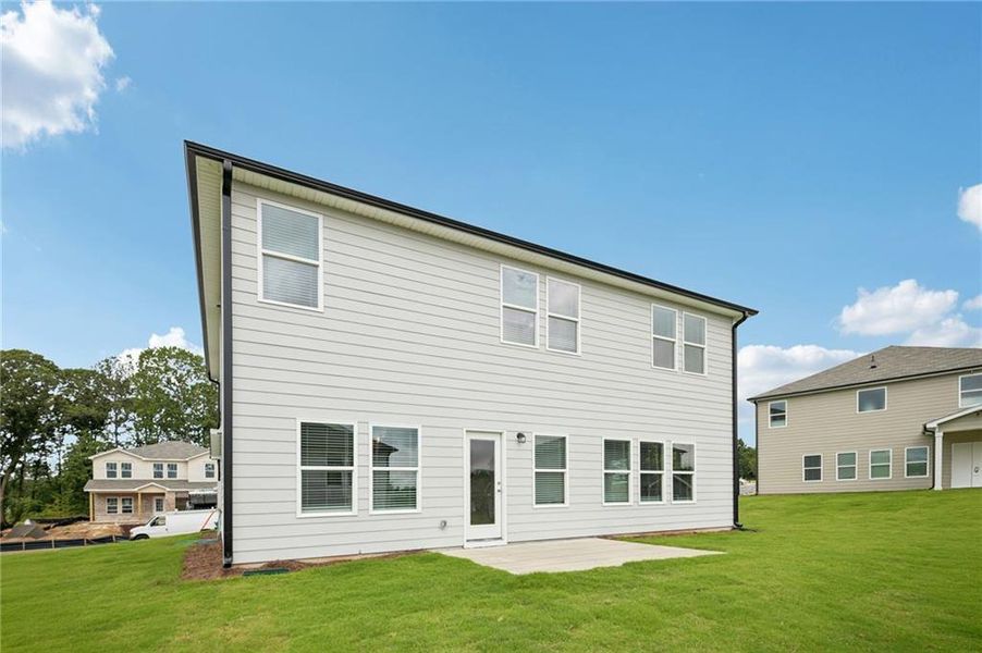 Exterior details and patio area of a home in Northwoods at Mirror Lake, Villa Rica (Image 3).