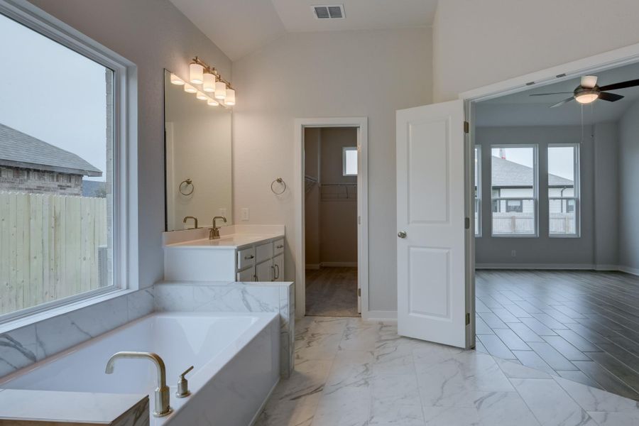 Representative furnished interior of a home built from the Guadalupe by Ashton Woods in The Heritage at Saddlebrook Ranch 70's, Schertz (Image 9).