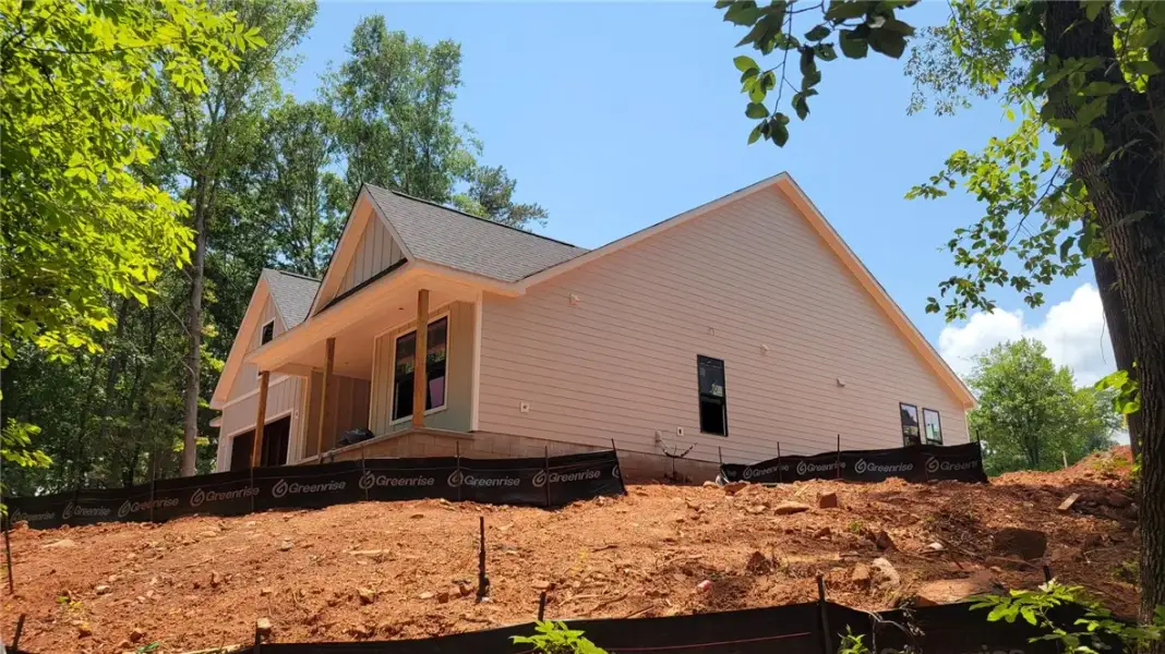 A new construction home, with light-colored siding