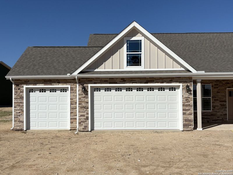 Front exterior of a new home in Lonesome Dove, San Antonio, TX, highlighting curb appeal (Image 2). Front exterior of a new home in Lonesome Dove, San Antonio, TX, highlighting curb appeal (Image 2).