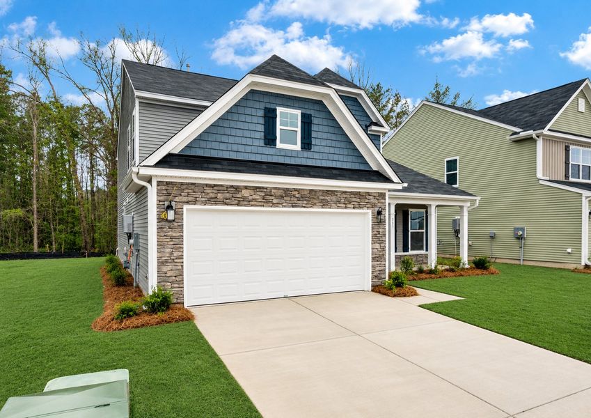 Front exterior of a new home in Oakley Pointe, Moncks Corner, SC, highlighting curb appeal (Image 23).