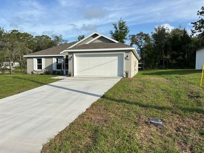 Front exterior of a new home in , Dunnellon, FL, highlighting curb appeal (Image 2). Front exterior of a new home in , Dunnellon, FL, highlighting curb appeal (Image 2).