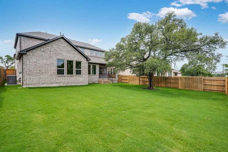 Representative exterior photo of a completed home built from the Peridot by Taylor Morrison in Parkside on the River 60s, Georgetown, TX (Image 15).