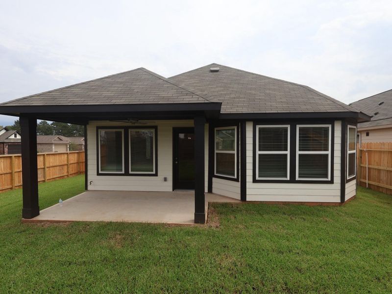 Front exterior of a new home in Moran Ranch, Willis, TX, highlighting curb appeal (Image 4). Front exterior of a new home in Moran Ranch, Willis, TX, highlighting curb appeal (Image 4).