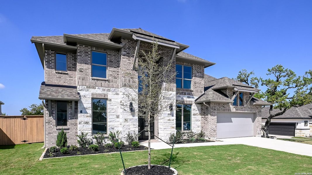Front exterior of a new home in Johnson Ranch, Bulverde, TX, highlighting curb appeal (Image 2). Front exterior of a new home in Johnson Ranch, Bulverde, TX, highlighting curb appeal (Image 2).