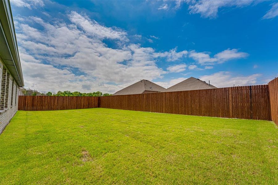Exterior details and patio area of a home in Fireside by the Lake, Garland (Image 3).