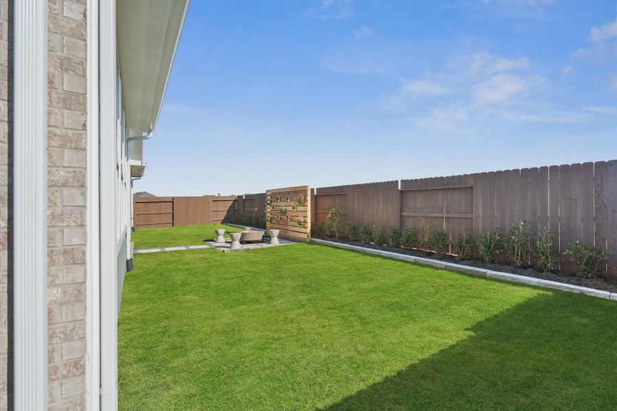 Representative exterior details of a home built from the Sweetwater by Chesmar Homes in Meridiana 50's and 60's, Manvel (Image 19).