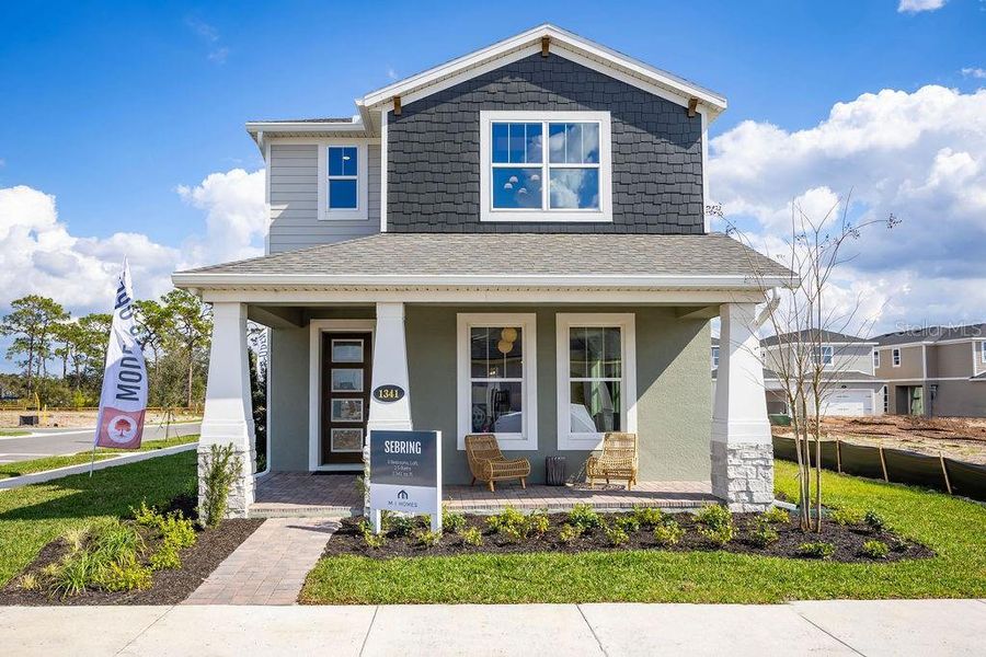 Front exterior of a new home in Center Lake on the Park, St. Cloud, FL, highlighting curb appeal (Image 2). Front exterior of a new home in Center Lake on the Park, St. Cloud, FL, highlighting curb appeal (Image 2).
