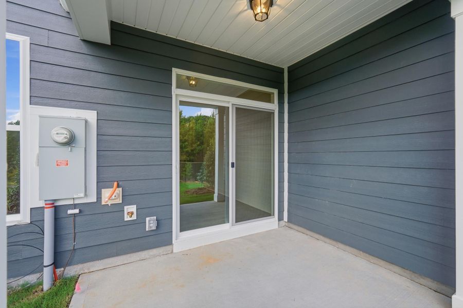 Exterior details and patio area of a home in Blythe Mill Townhomes, Waxhaw (Image 4).