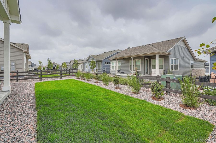 Front exterior of a new home in Hilltop 55+ at Inspiration 55s, Aurora, CO, highlighting curb appeal (Image 2).
