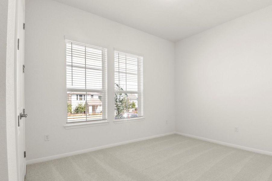 Unfurnished room with light carpet and baseboards