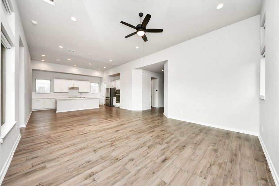 Open living area with abundant natural light and modern finishes