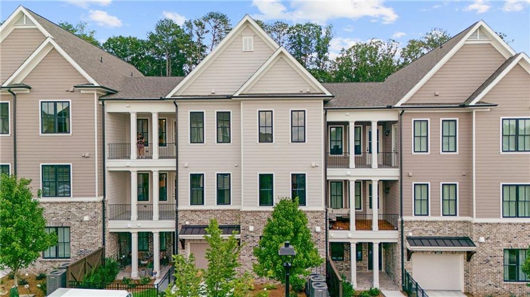 Front exterior of a new home in Waterside Condos, Peachtree Corners, GA, highlighting curb appeal (Image 1).