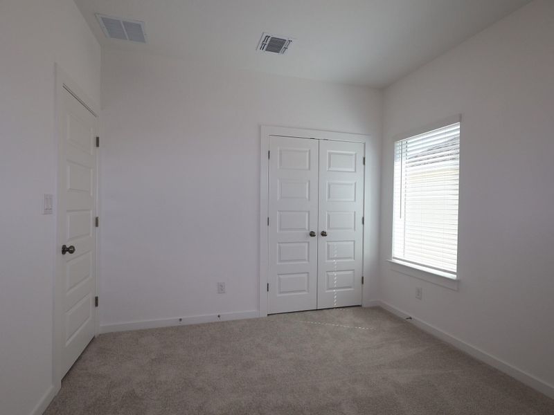 Spacious, unfurnished interior of a new home in Heritage, Dripping Springs (Image 25).