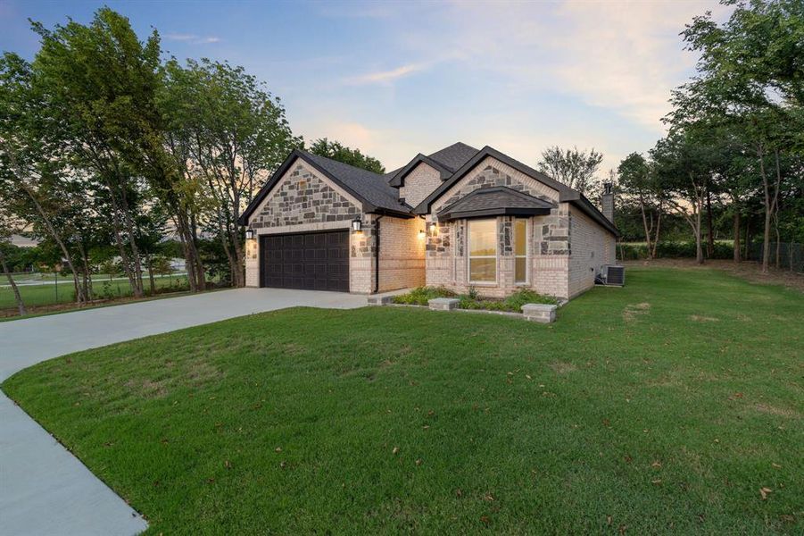 Front exterior of a new home in , Gainesville, TX, highlighting curb appeal (Image 19). Front exterior of a new home in , Gainesville, TX, highlighting curb appeal (Image 19).