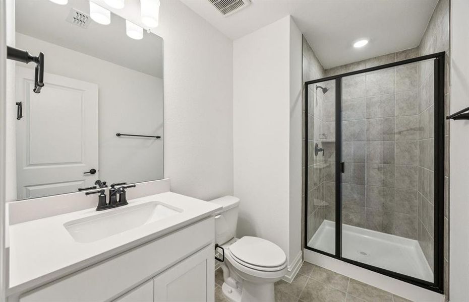 Secondary bath featuring a walk-in shower Secondary bath featuring a walk-in shower