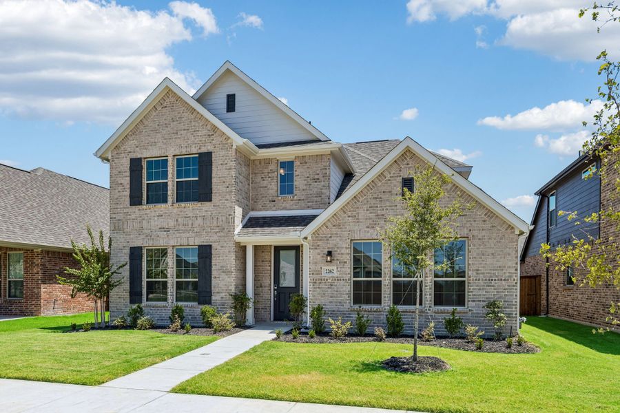 Front exterior of a new home in Dove Hollow, Waxahachie, TX, highlighting curb appeal (Image 23). Front exterior of a new home in Dove Hollow, Waxahachie, TX, highlighting curb appeal (Image 23).