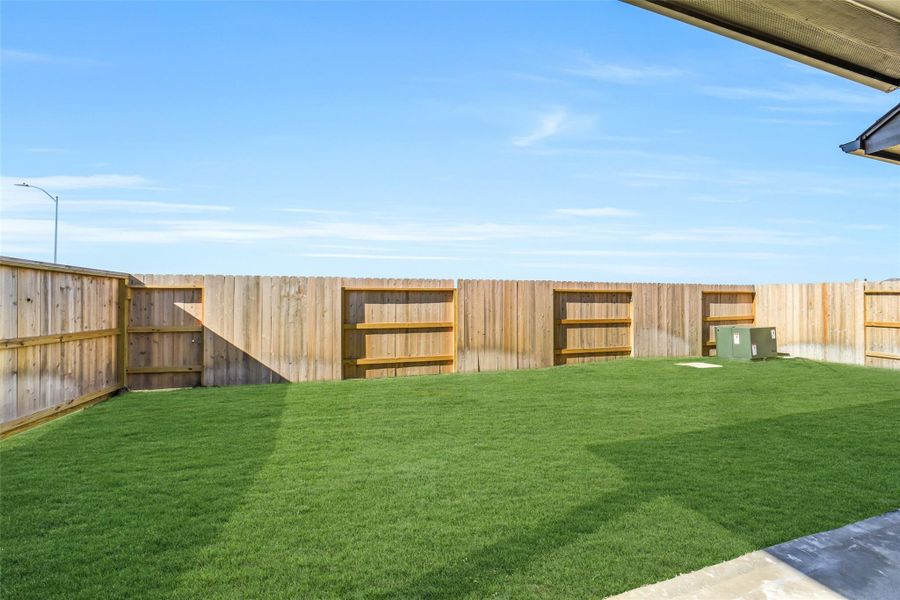 Exterior details and patio area of a home in Sunterra, Katy (Image 26).