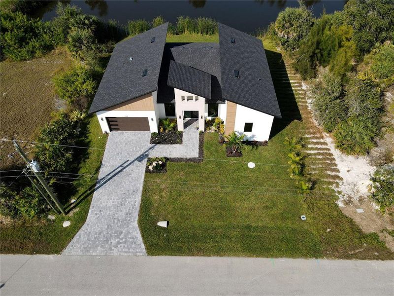 Front exterior of a new home in , Port Charlotte, FL, highlighting curb appeal (Image 26). Front exterior of a new home in , Port Charlotte, FL, highlighting curb appeal (Image 26).