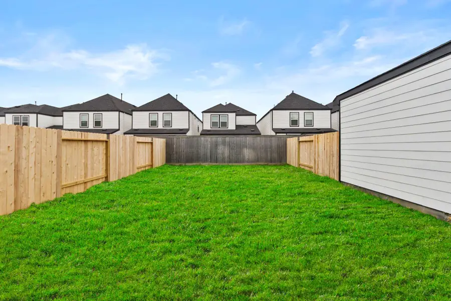 Exterior details and patio area of a home in Grand West, Houston (Image 3).