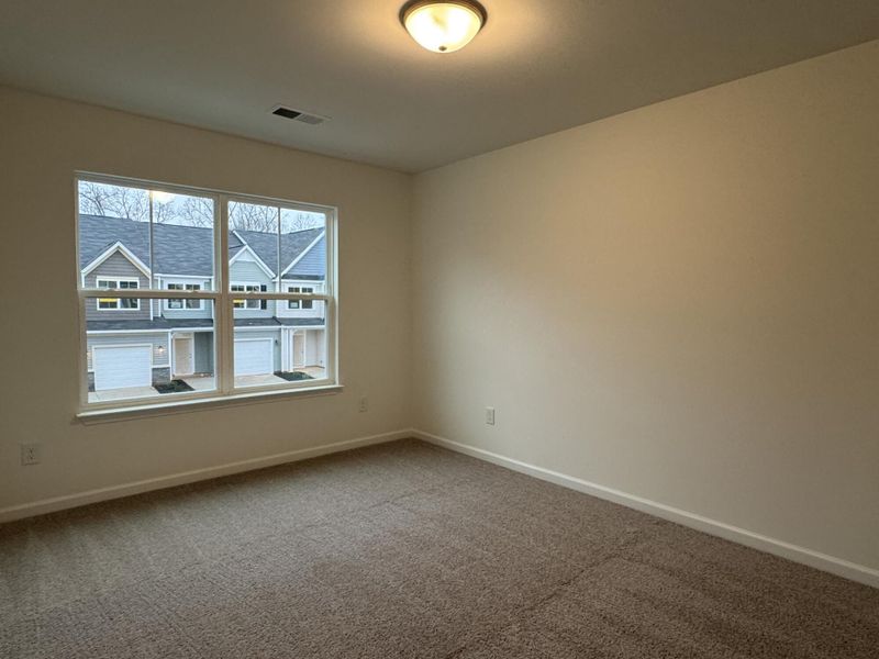 Spacious, unfurnished interior of a new home in East Main Townes, Spartanburg (Image 13).