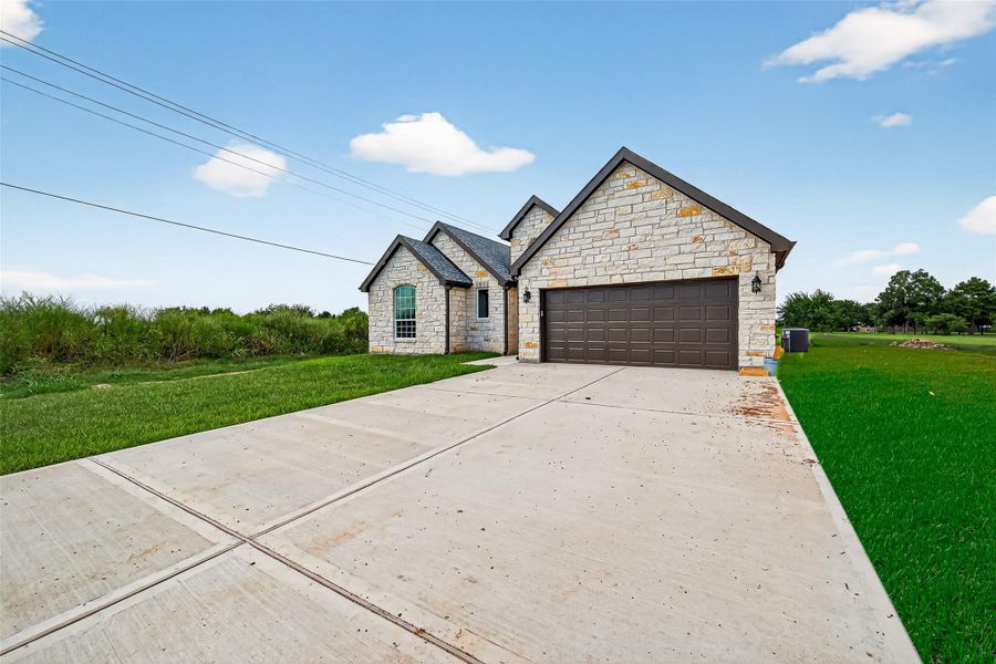Front exterior of a new home in , Prairie View, TX, highlighting curb appeal (Image 26).