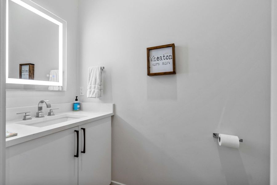 Half bathroom off the laundry room and garage.