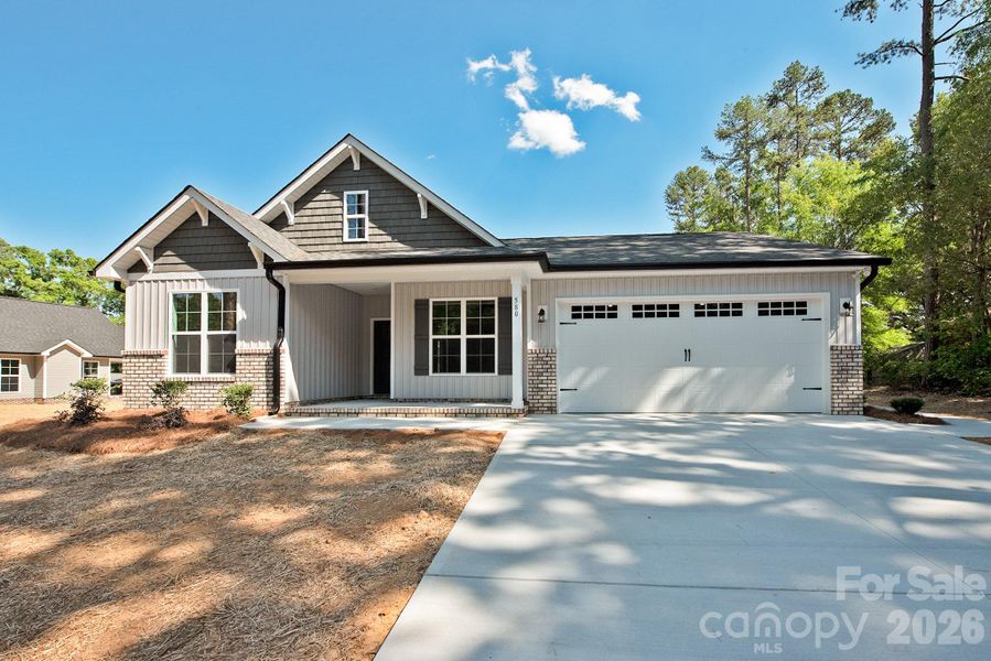 Front exterior of a new home in , Concord, NC, highlighting curb appeal (Image 19).