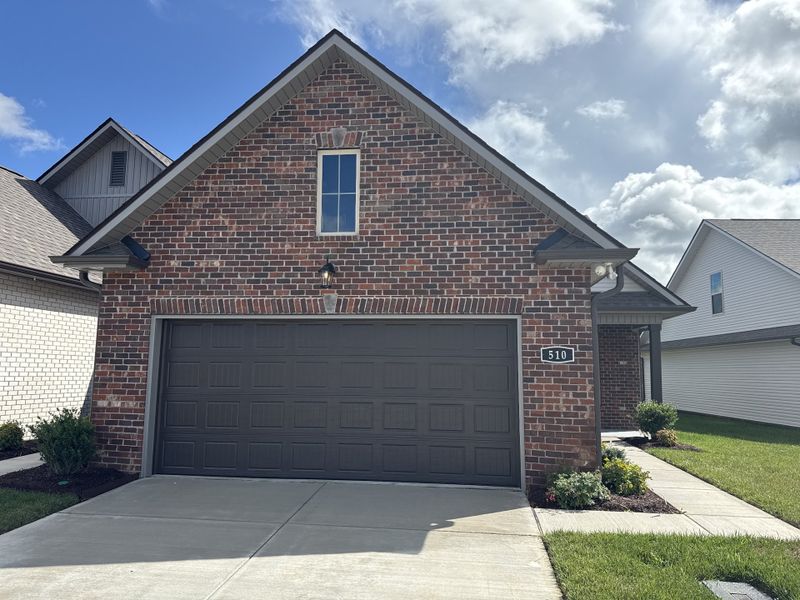 Front exterior of a new home in The Greens at Legacy Townhomes, Springfield, TN, highlighting curb appeal (Image 16).