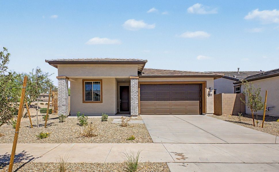 Front exterior of a new home in Frontera, Surprise, AZ, highlighting curb appeal (Image 1). Front exterior of a new home in Frontera, Surprise, AZ, highlighting curb appeal (Image 1).