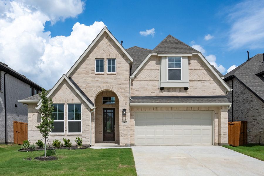 Front exterior of a new home in Timberbrook, Justin, TX, highlighting curb appeal (Image 1). Front exterior of a new home in Timberbrook, Justin, TX, highlighting curb appeal (Image 1).