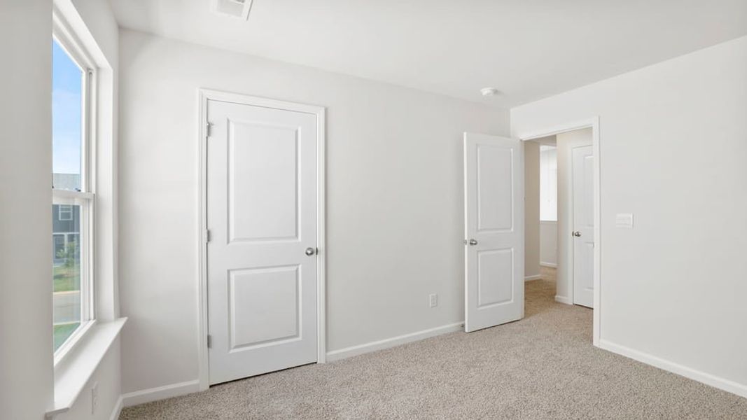 Spacious, unfurnished interior of a new home in Durbin Meadows Traditions, Fountain Inn (Image 28).