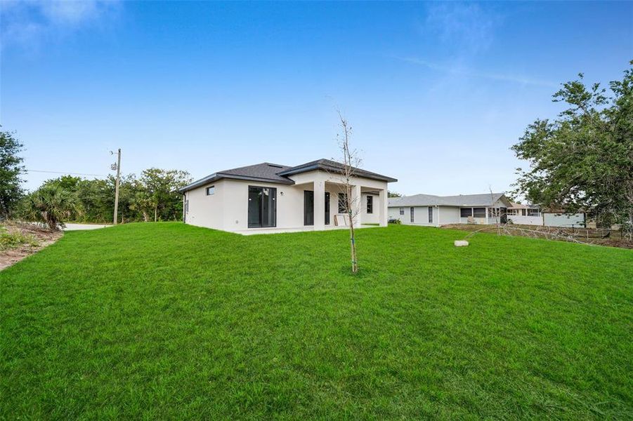 Front exterior of a new home in , Englewood, FL, highlighting curb appeal (Image 14).